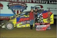  ??  ?? Coalcracke­r 72 winner Duane Howard, right, celebrates in victory lane with daughter Erica at Big Diamond on Sept. 3.