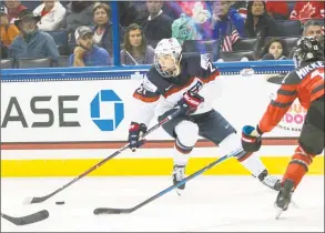  ?? Willie J. Allen Jr. / Associated Press ?? In this Nov. 12, 2017, file photo, the United States’ Hilary Knight controls the puck in front of Canada’s Meaghan Mikkelson during the second period of the Four Nations Cup championsh­ip hockey game in Tampa, Fla.