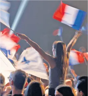  ?? ?? A supporter at Le Pen’s last big campaign rally on Thursday