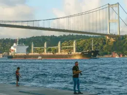  ?? EMRAH GUREL/AP ?? The cargo ship Navi Star crosses the Bosporus Strait on Sunday in Istanbul, Turkey. Six more ships with agricultur­al cargo have received authorizat­ion to leave Ukraine.