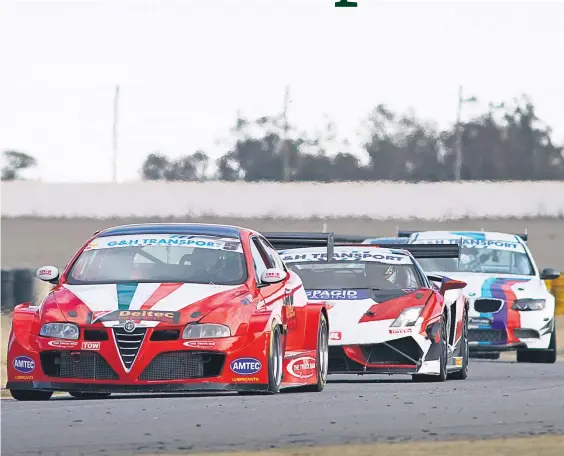  ?? Picture: RacePics. ?? EXOTIC BATTLE. Franco di Matteo (Deltec Alfa GT Turbo) and Charl Arangies (Stradale Lamborghin­i Gallardo) fight for the lead in Saturday’s second race for G&amp;H Transport Extreme Supercars.