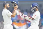  ??  ?? Virat Kohli (left) and Ajinkya Rahane take a brief break during the second day in Indore. ANSHUMAN POYREKAR/HT PHOTO