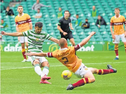  ?? Picture: SNS. ?? Celtic’s Albian Ajeti scores to make it 2-0 against Motherwell at Celtic Park.