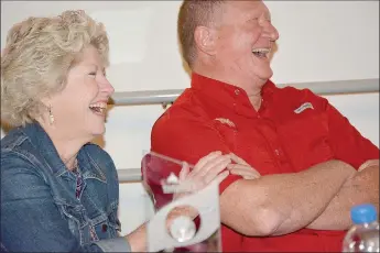  ?? Graham Thomas/Siloam Sunday ?? Brenda and Tim McCord, honorees at the 2018 Outstandin­g Civic Leadership Event, share a hearty laugh while being roasted and toasted Thursday at the Brick Ballroom in downtown Siloam Springs.