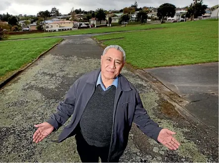  ??  ?? Reverend Perema Leasi on Housing NZ land that has stood empty since 2008. Labour housing spokesman Phil Twyford