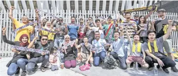  ??  ?? Team Malaysia and team Vietnam supporters showing their tickets to the first match of the Suzuki AFF Cup 2018 final during a survey at Bukit Jalil National Stadium in Kuala Lumpur yesterday. - Bernama photo