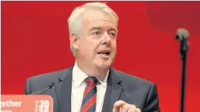  ??  ?? > First Minister Carwyn Jones today signs the Swansea Bay City Region deal