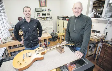  ??  ?? Dylan Rovere, left, and Dave Cahill at Old Town Strings on Hillside Avenue.