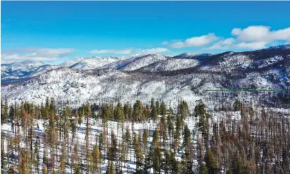  ?? Photograph: Anadolu/Getty Images ?? A view of Sierra Nevada mountains covered with snow near Lake Tahoe in California, on Sunday.