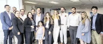  ?? PEDRO PORTAL pportal@miamiheral­d.com ?? Lissette Calderon, center, says the Neology office is ‘just a box if it didn’t have the people that were here every day. For that I am really grateful, for my team, because it is really about them.’