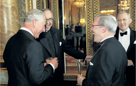  ?? SUBMITTED PHOTO ?? St. Catharines resident Peter Partridge, front right, meets Prince Charles, left, during a reception at Buckingham Palace on July 4.