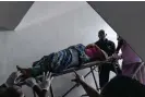  ?? Photograph: Kasia Strkę /The Guardian ?? Lawal Arinola being brought up to surgery at Lagos Island maternity hospital.