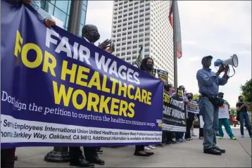  ?? MYUNG J. CHUN — LOS ANGELES TIMES VIA GETTY IMAGES ?? Stan Lyles, vice president of the SEIU-UHW union representi­ng health care workers, speaks outside the offices of the Hospital Associatio­n of Southern California at a protest in favor of raising the minimum wage to $25an hour for California health care workers.