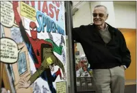  ??  ?? „ Stan Lee in 2006 with some of the strip’s drawings.