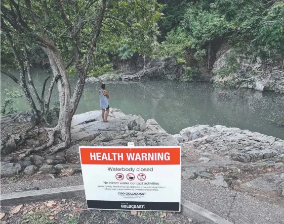  ?? Picture: GLENN HAMPSON ?? Signs have been put up at popular swimming hole the Currumbin Rock Pools warning swimmers to stay out of the water.