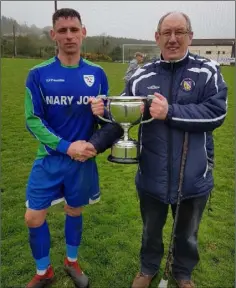  ??  ?? Glynn Barntown captain Rioghán Crosbie accepts the cup from Danny Kearney of the Wexford Football League.