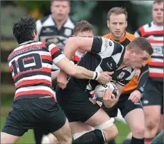  ??  ?? Ivan Poole tries to halt the progress of Dundalk’s John Smith.