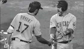  ?? AP file photo ?? Former catcher David Ross (right), shown with third baseman Kris Bryant in 2015, has reportedly been hired as the new manager of the Chicago Cubs. Ross won a World Series with the Cubs in 2016 and with the Boston Red Sox in 2013.