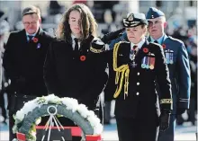  ?? SEAN KILPATRICK THE CANADIAN PRESS ?? Governor General Julie Payette places a wreath with her son during Remembranc­e Day in Ottawa. Some historians say Canada’s efforts to commemorat­e the WWI centenary paled in comparison to our allies’.