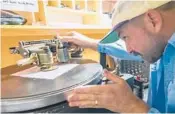  ?? YORK TIMES
AJ MAST/THE NEW ?? Moose Adamson sets up a lathe to cut records individual­ly Oct. 5 at Joyful Noise in Indianapol­is.