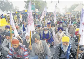  ?? ANI ?? Farmers at a protest against the new farm laws at Singhu Border near Delhi on Sunday.