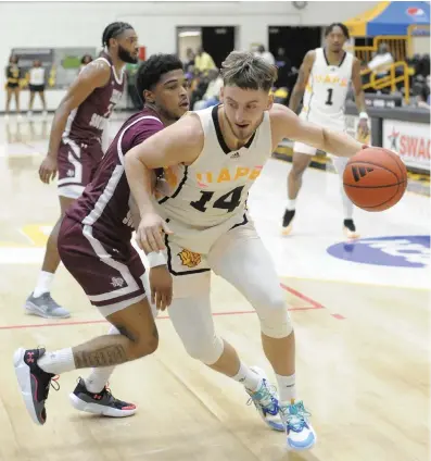  ?? (Special to the Commercial/William Harvey) ?? UAPB guard Kaine McColley makes a move toward the basket during a Feb. 26 men’s basketball game at H.O. Clemmons Arena in Pine Bluff.