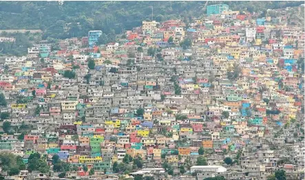  ?? Photos: Paula Worthingto­n/for the Calgary Herald ?? Port-au-Prince is a multi-coloured hodgepodge of homes stacked up the hills. It’s a dizzying and exhilarati­ng place.