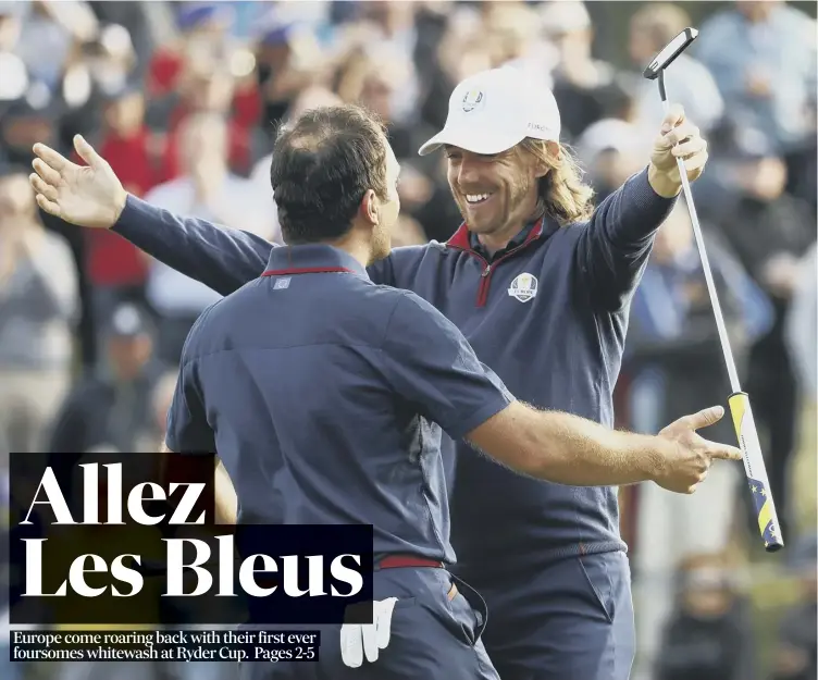  ??  ?? Europe’s Francesco Molinari and Tommy Fleetwood, right, celebrate on the 14th green following their 5&amp;4 foursomes victory over US duo Justin Thomas and Jordan Spieth at the Ryder Cup at Le Golf National.