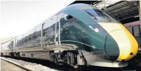  ??  ?? > One of the new Hitachi non-electric trains at Swansea station