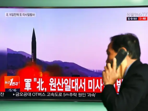  ??  ?? Footage of a North Korean missile launch is shown at a railway station in Seoul (Getty)