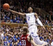  ?? CHRIS SEWARD — THE ASSOCIATED PRESS ?? Duke’s Cam Reddish drives to the hoop against North Carolina State’s Wyatt Walker on Feb. 16.