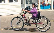  ?? Picture / NZ Herald Focus ?? Zane Kukutai-Seumanu says he likes his bike because he can race his friends with it.