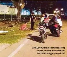  ??  ?? ANGGOTA polis menahan seorang suspek selepas melarikan diri bersama tangga yang dicuri.