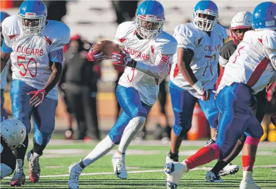  ?? ALLEN CUNNINGHAM/FOR THE SUN-TIMES ?? Crane senior quarterbac­k Elijah Hooker, who made several big plays, had 16 carries for 71 yards and two touchdowns Thursday against Harper.