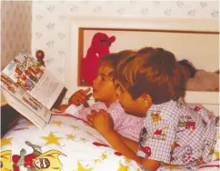  ??  ?? Kovrig and Ariana, as youngsters, reading before bed. From his jail cell, Kovrig requested long lists of books.