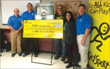  ?? Herald photo by Dale Woodard ?? Toby and Bernadine Boulet — parents of Logan Boulet — present the Logan Boulet Fund cheque for KidSport Lethbridge/Taber to KidSport committee members (from left) Dave Gaskell, Jon Dick and Darren Whitel.