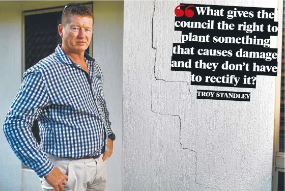  ?? Picture: ALIX SWEENEY ?? Troy Standley is battling the Townsville City Council over who is to blame for the structural damage, such as these large cracks, to his house.
INSETS: The large tree before it was cut down, and the stump that remains after the tree was removed.