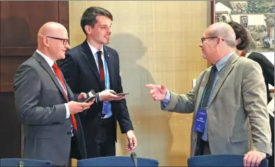  ?? WANG ZHUANGFEI / CHINA DAILY ?? Roman Zamboch (right), director of the press office of the Chamber of Deputies of the Parliament of the Czech Republic, speaks with other delegates at the China-CEEC Spokespers­ons Dialogue in Beijing on Monday.