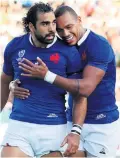  ??  ?? Try that: Yoann Huget (left) of France celebrates scoring his side’s first try with Gael Fickou