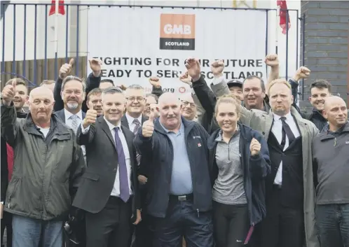  ??  ?? 0 Finance Secretary Derek Mackay visited the yard yesterday where he was greeted by workers and union members