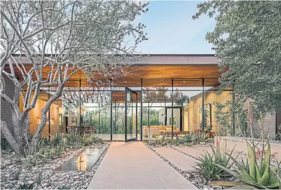  ?? BILL TIMMERMAN/THE ASSOCIATED PRESS ?? Courtyards are becoming popular again, as they allow the beauty of an outdoor space to be viewed from several areas of a home.