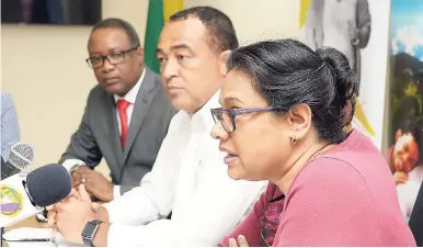  ?? FILE ?? Chief Medical Officer Dr Jacquiline Bisasor-McKenzie (left) speaking at a press conference called to annouce that the island is facing a dengue outbreak. Looking on are Minister of Health Dr Christophe­r Tufton (centre) and Dunstan Bryan, permanent secretary in the Ministry of Health.