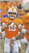  ?? STAFF PHOTO BY C.B. SCHMELTER ?? Keller Chryst (19) warms up with fellow Tennessee quarterbac­k Jarrett Guarantano before the Vols’ home game against Florida in September.