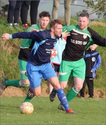  ??  ?? P.J. Banville of Campile United is tracked by Páidí Cullen and Martin Kehoe of Cloughbawn during their Division 1 match in Clonroche.