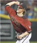  ?? PATRICK BREEN/THE REPUBLIC ?? The Diamondbac­ks’ Zack Greinke has been dominant, recording a 1.16 ERA over his last seven starts.