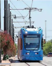  ?? DOUG HOKE, THE OKLAHOMAN ARCHIVES] [PHOTO BY ?? A streetcar travels west on Reno in Bricktown.