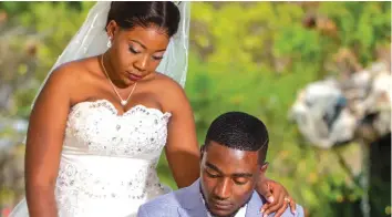  ??  ?? Alive In Christ Ministries leader prophet Arthur Buranda signing his marriage certificat­e while wife Tracy looks on during a wedding ceremony in Harare recently