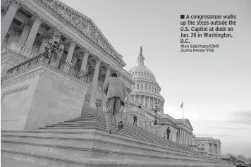  ?? Alex Edelman/CNP/ Zuma Press/TNS ?? ■ A congressma­n walks up the steps outside the U.S. Capitol at dusk on Jan. 20 in Washington, D.C.