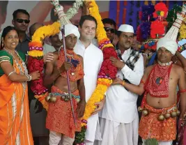  ?? — PTI ?? Congress vice-president Rahul Gandhi is garlanded at a public meeting at Dedia Pada tribal belt in Narmada district of Gujarat on Monday.