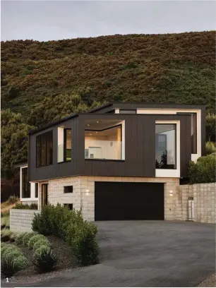  ??  ?? 1 —The upper section of the home is clad with Stria Cladding by James Hardie. 2 —The cladding is painted in Resene Ironsand. 3 —Dark Stria Cladding by James Hardie contrasts with other materials in the home, including white plaster and concrete block. 1